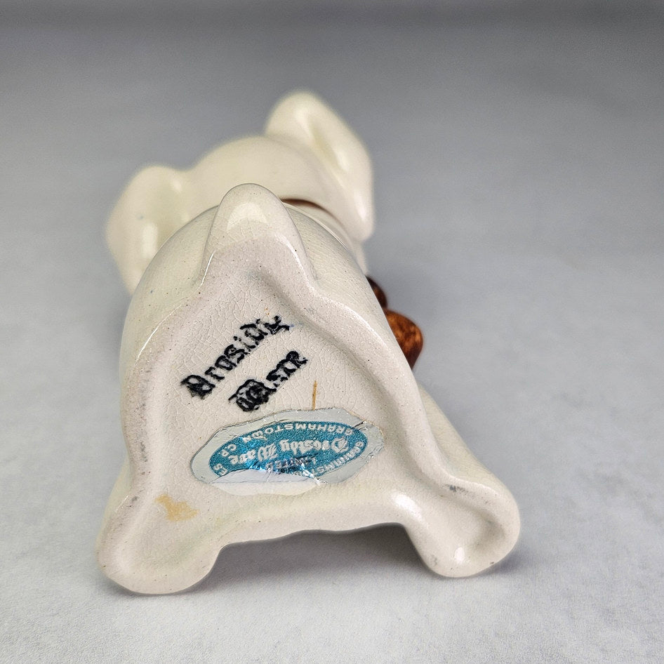Drostdy Ware Cream Dog with Brown Bow