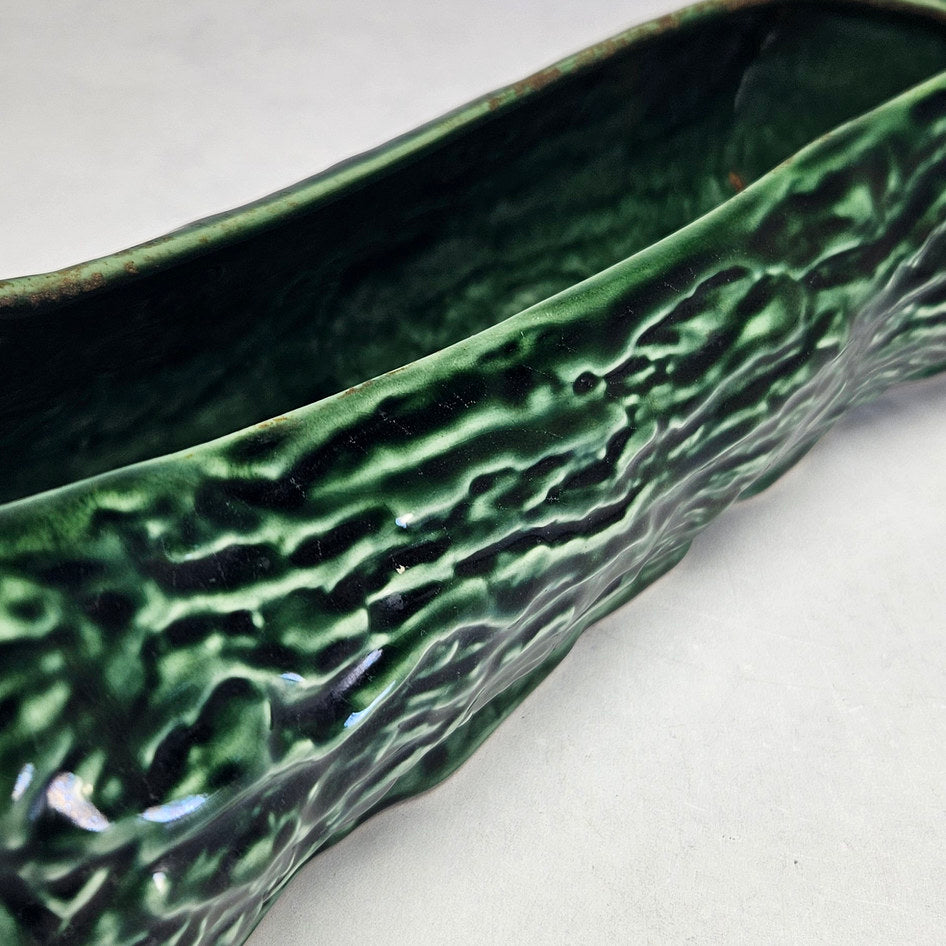 Drostdy Ware green log planter interior showing brown surface marks