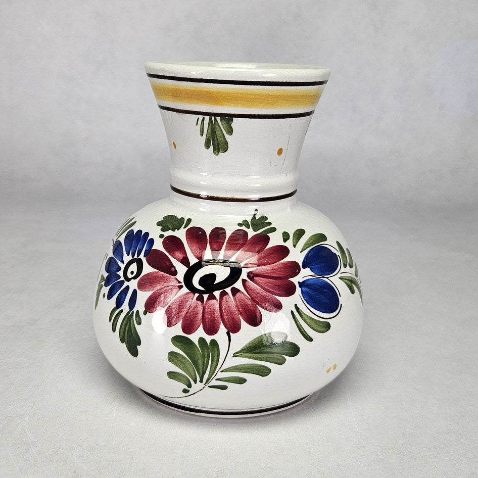 Dutch polychrome floral vase with burgundy flowers and yellow neck band