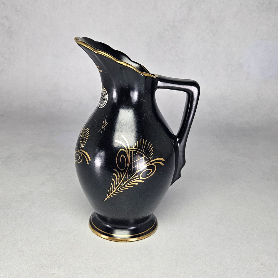 Flora Gouda Ora black ceramic jug with gilt scroll decoration