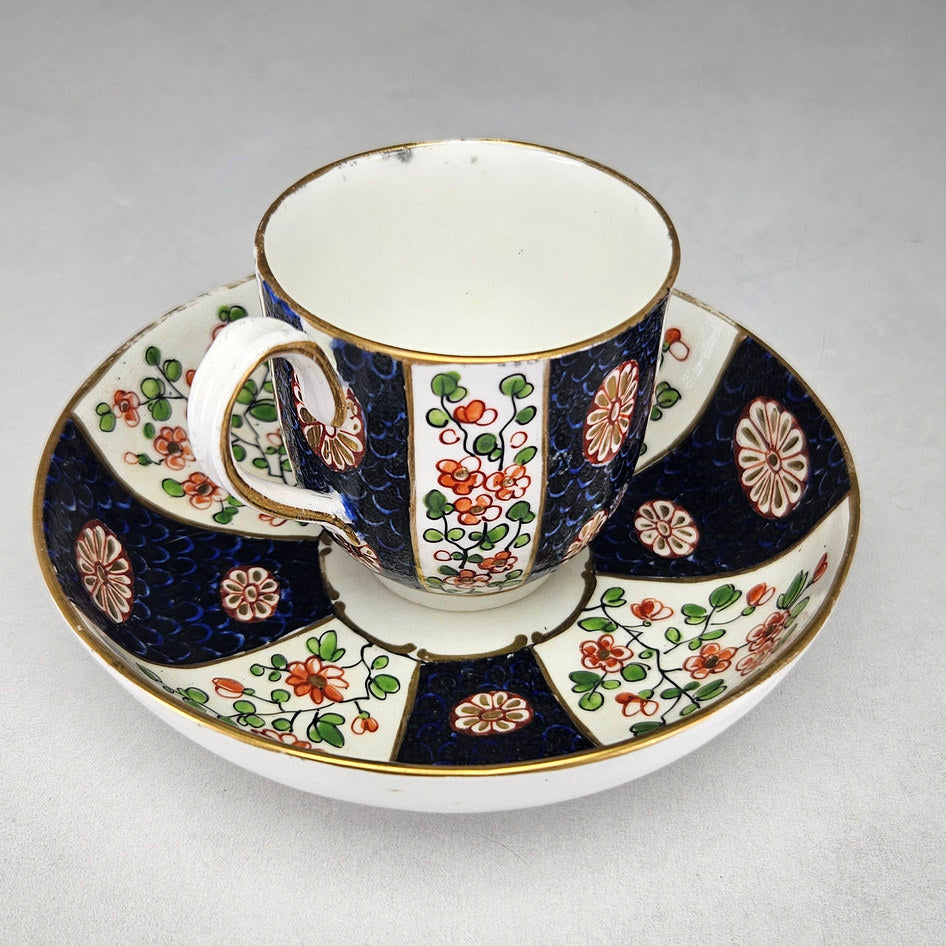 Reverse view of Worcester floral cup and blue scale saucer