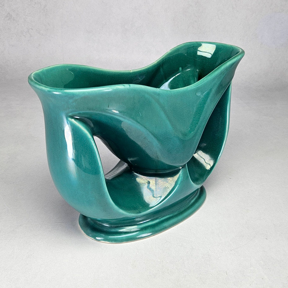 Lucia Ware attributed turquoise vase showing sweeping curved supports