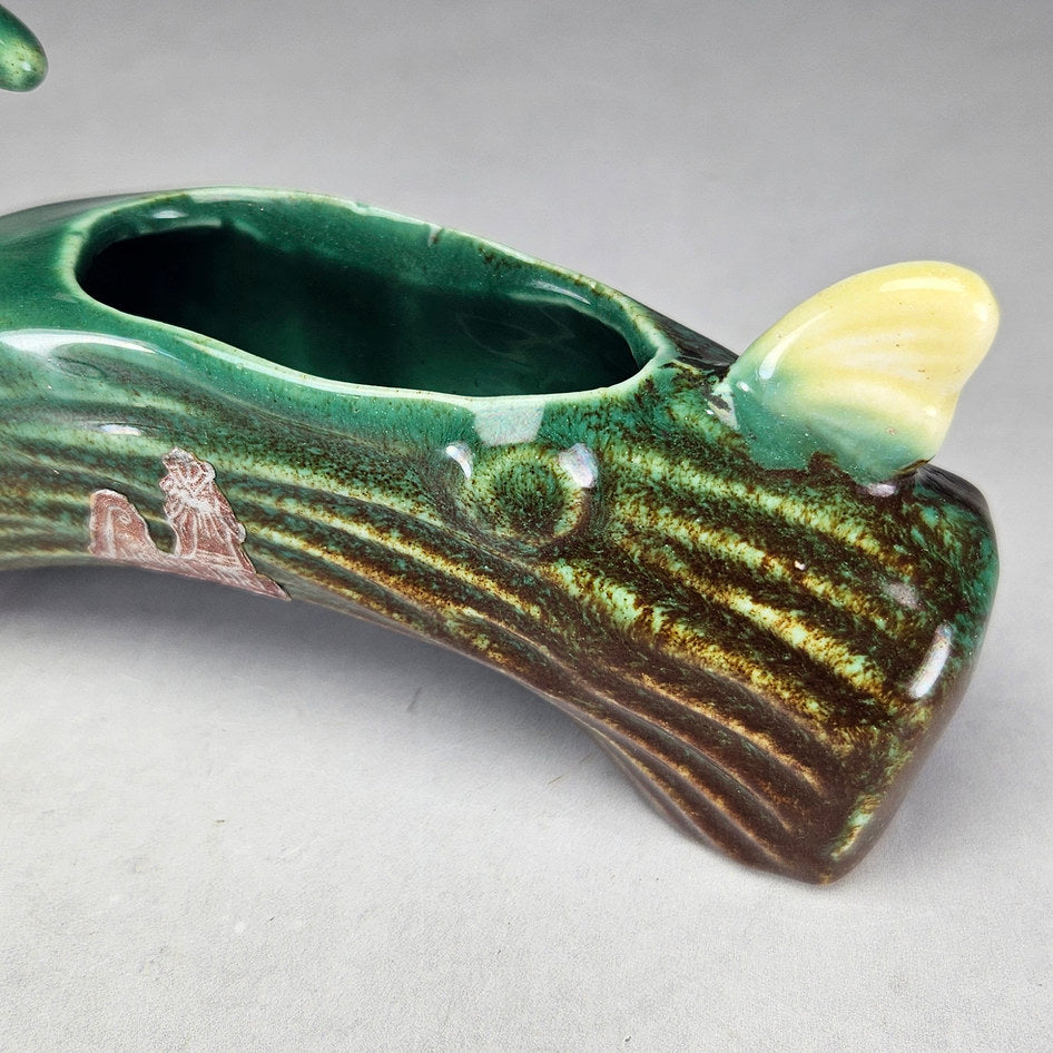 Lucia Ware bird log planter showing arched ceramic reverse