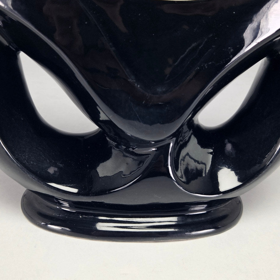 Lucia Ware black ceramic mantel vase with pierced teardrop openings
