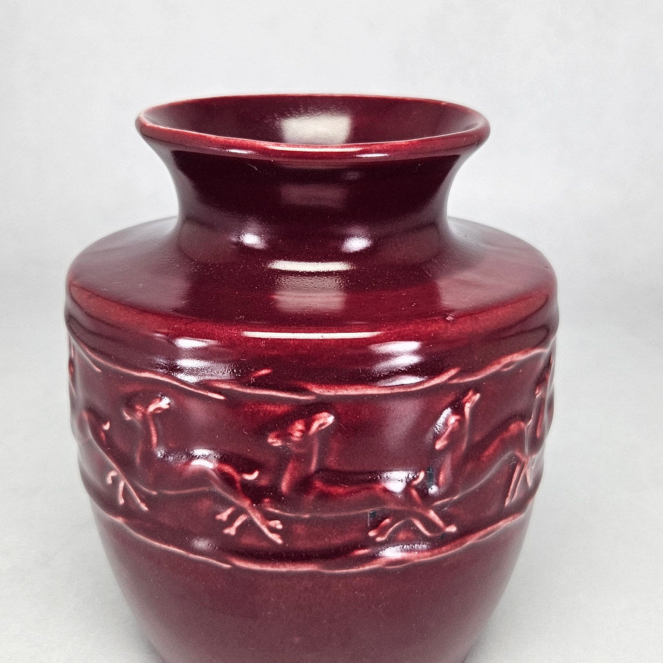 Lucia Ware burgundy ceramic vase with running antelope relief 4412