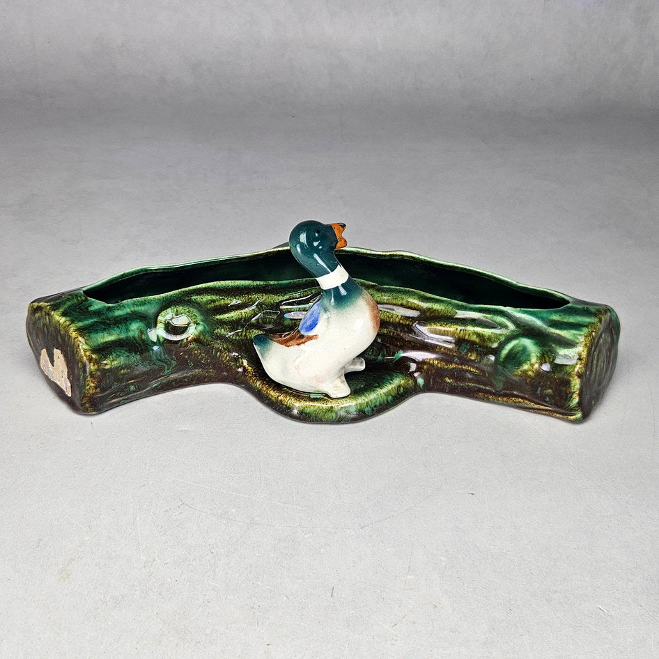 Lucia Ware duck log planter with green bark-textured body