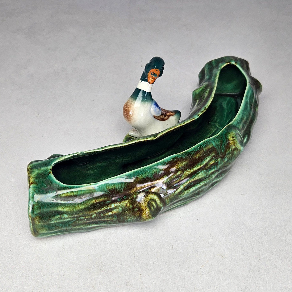 Lucia Ware duck log planter showing elongated planting opening