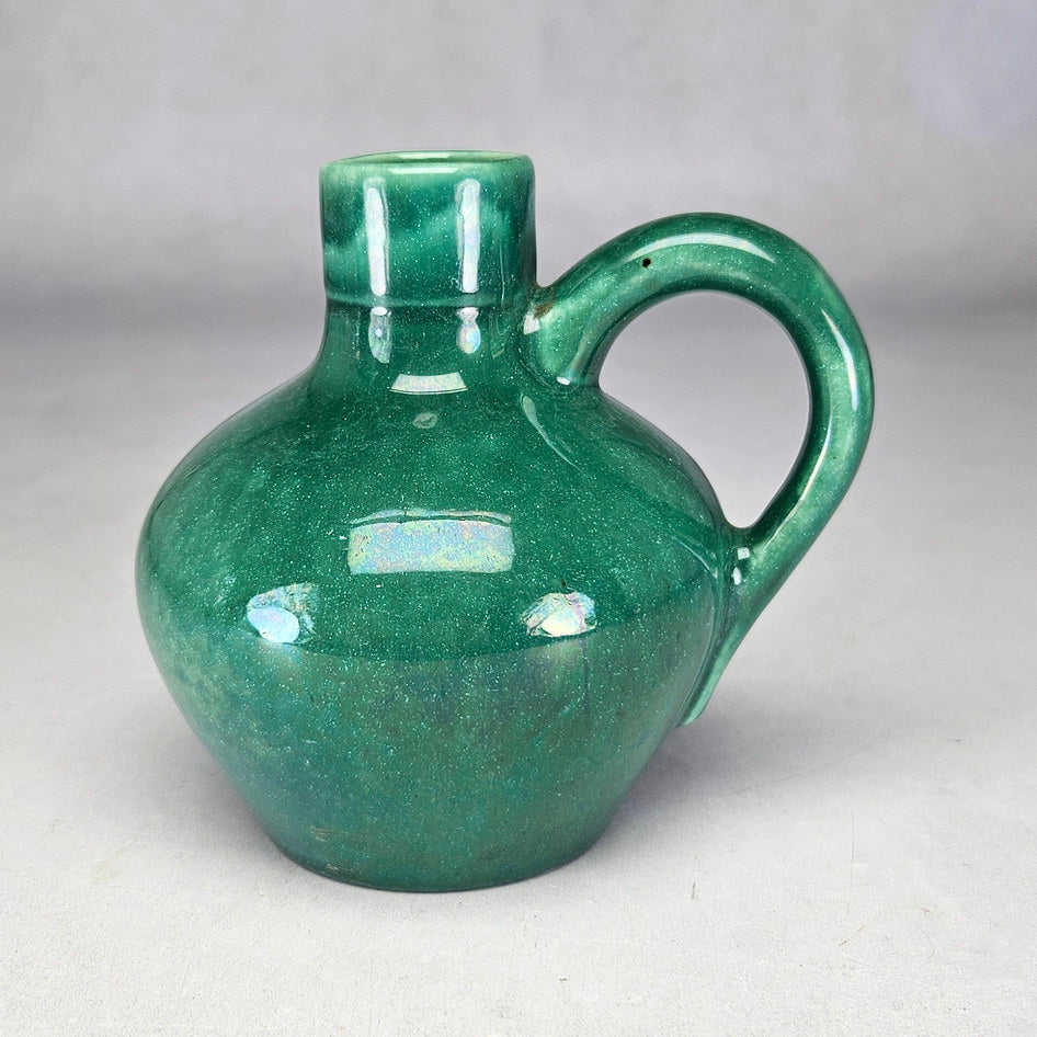 Lucia Ware green bottle vase with curved loop handle