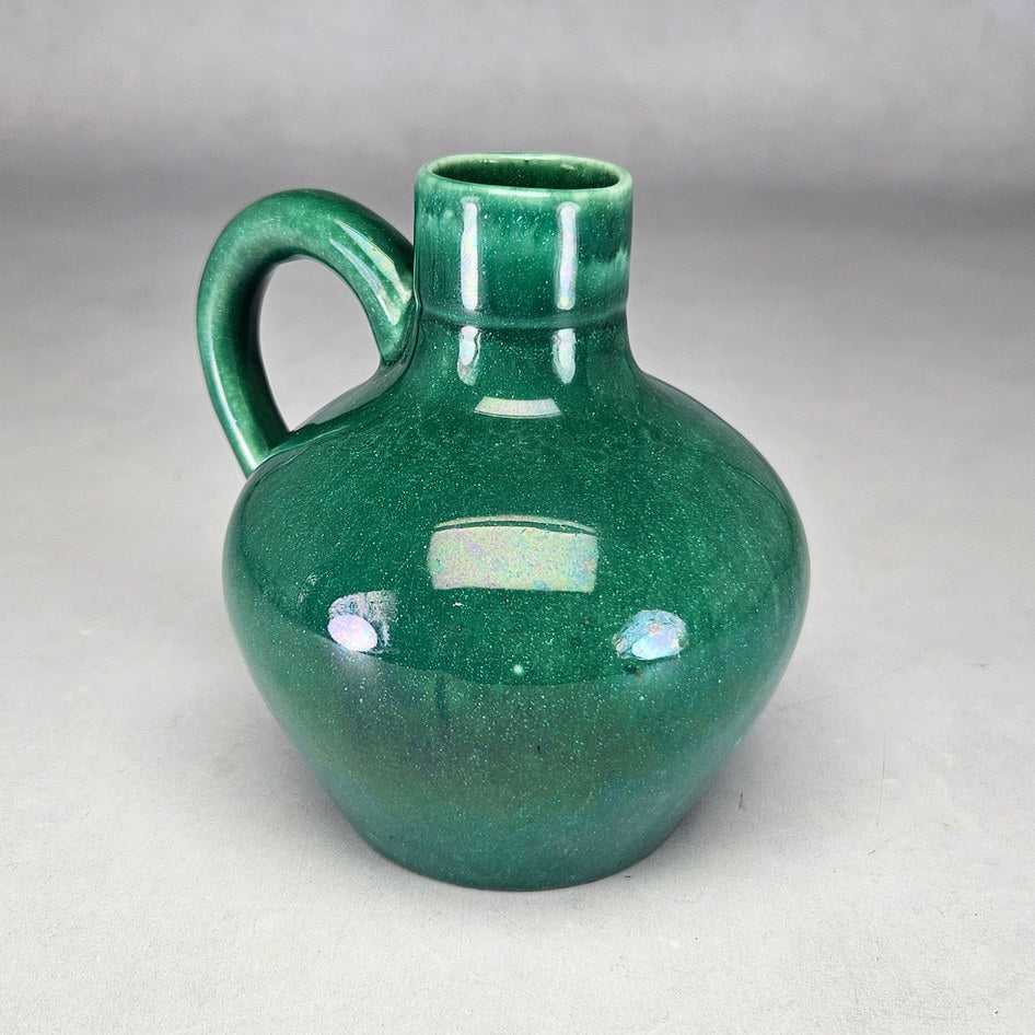 Lucia Ware green bottle vase showing short cylindrical neck