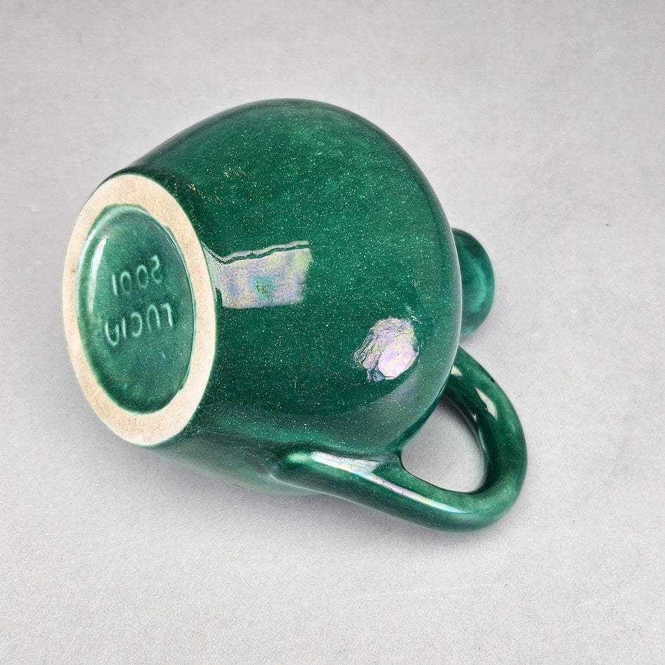 Lucia Ware green bottle vase showing finely speckled glaze