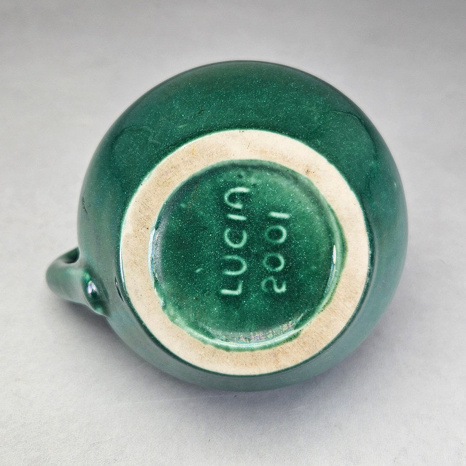 Lucia Ware green bottle vase underside showing maker marking