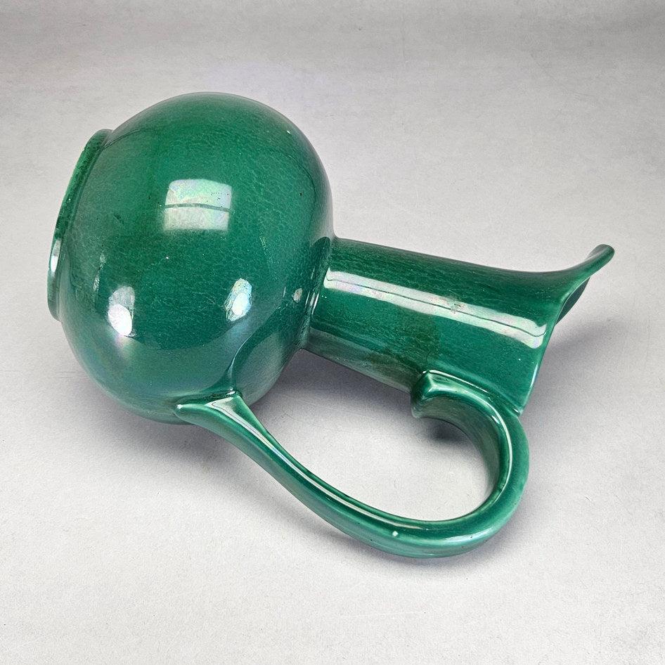 Lucia Ware green tall-neck ewer showing curved handle profile