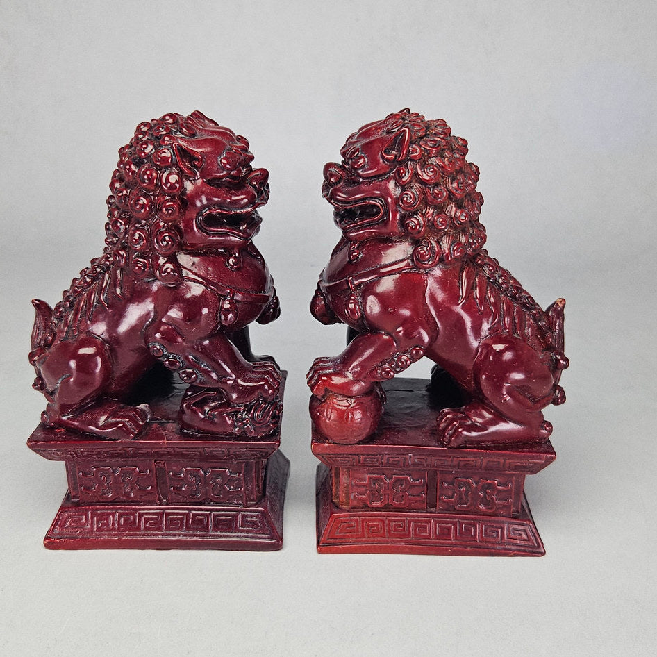 Pair of Chinese Red Cinnabar-Style Resin Foo Dog Figurines