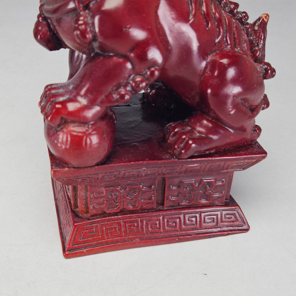 Pair of Chinese Red Cinnabar-Style Resin Foo Dog Figurines