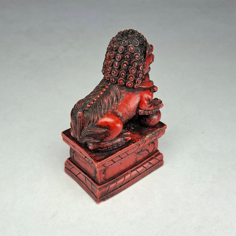 Pair of Red and Black Cast Stone Chinese Guardian Lions