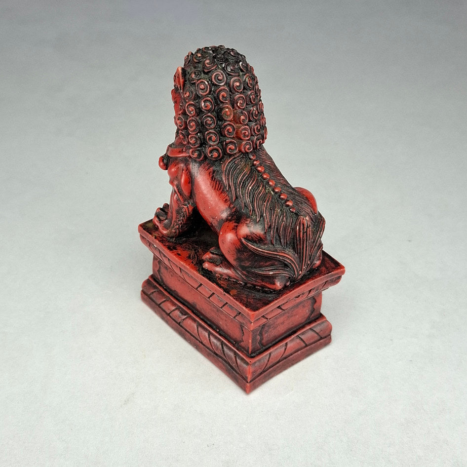 Pair of Red and Black Cast Stone Chinese Guardian Lions