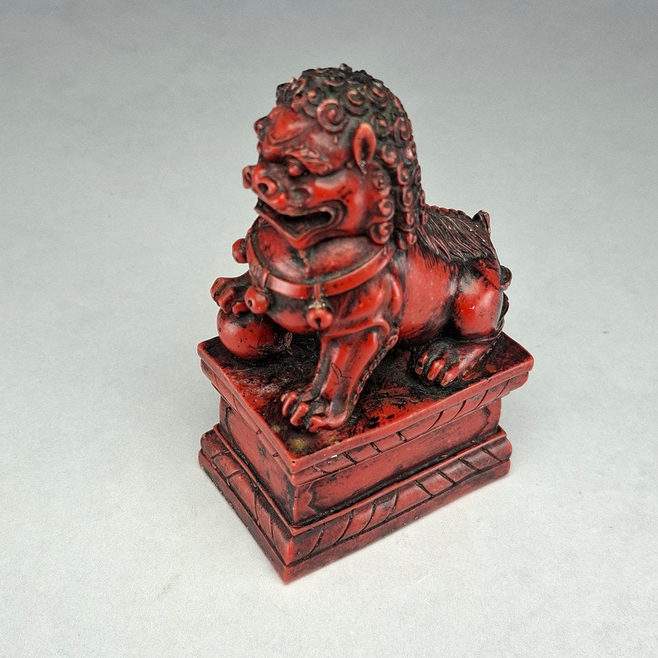 Pair of Red and Black Cast Stone Chinese Guardian Lions