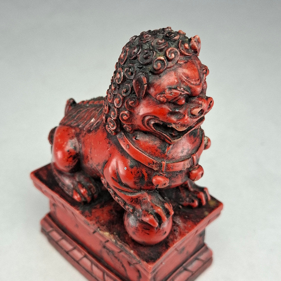 Pair of Red and Black Cast Stone Chinese Guardian Lions