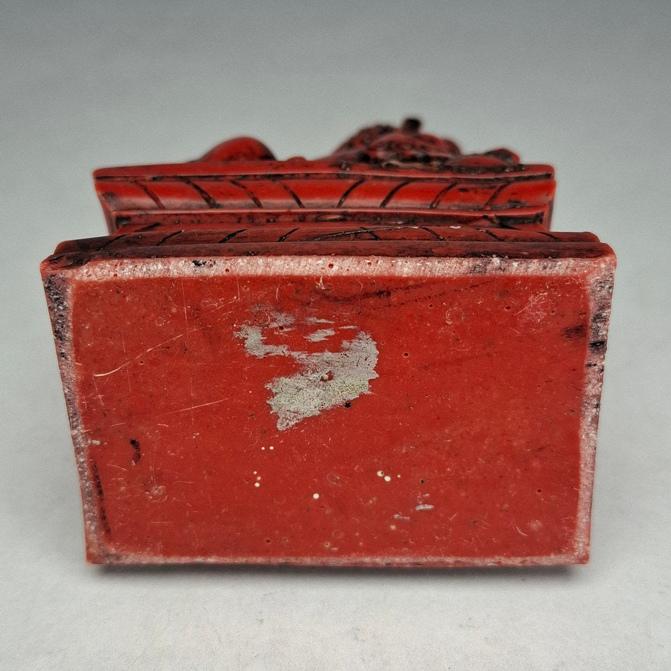 Pair of Red and Black Cast Stone Chinese Guardian Lions