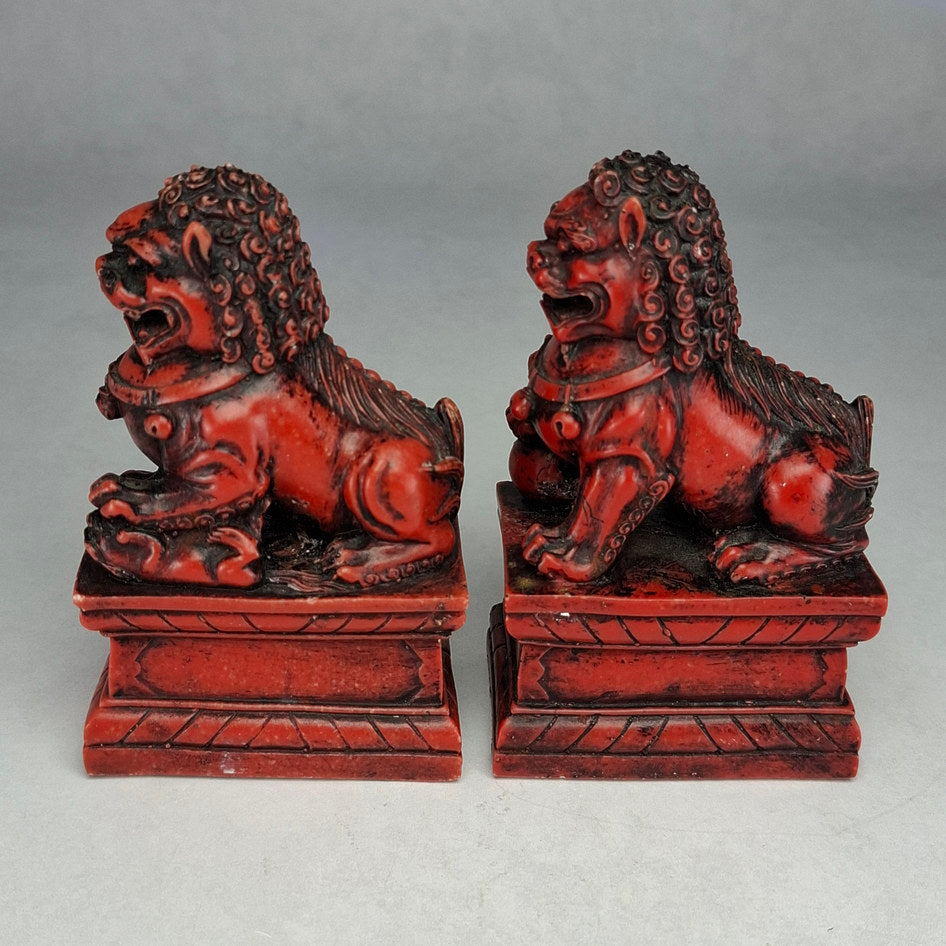 Pair of Red and Black Cast Stone Chinese Guardian Lions