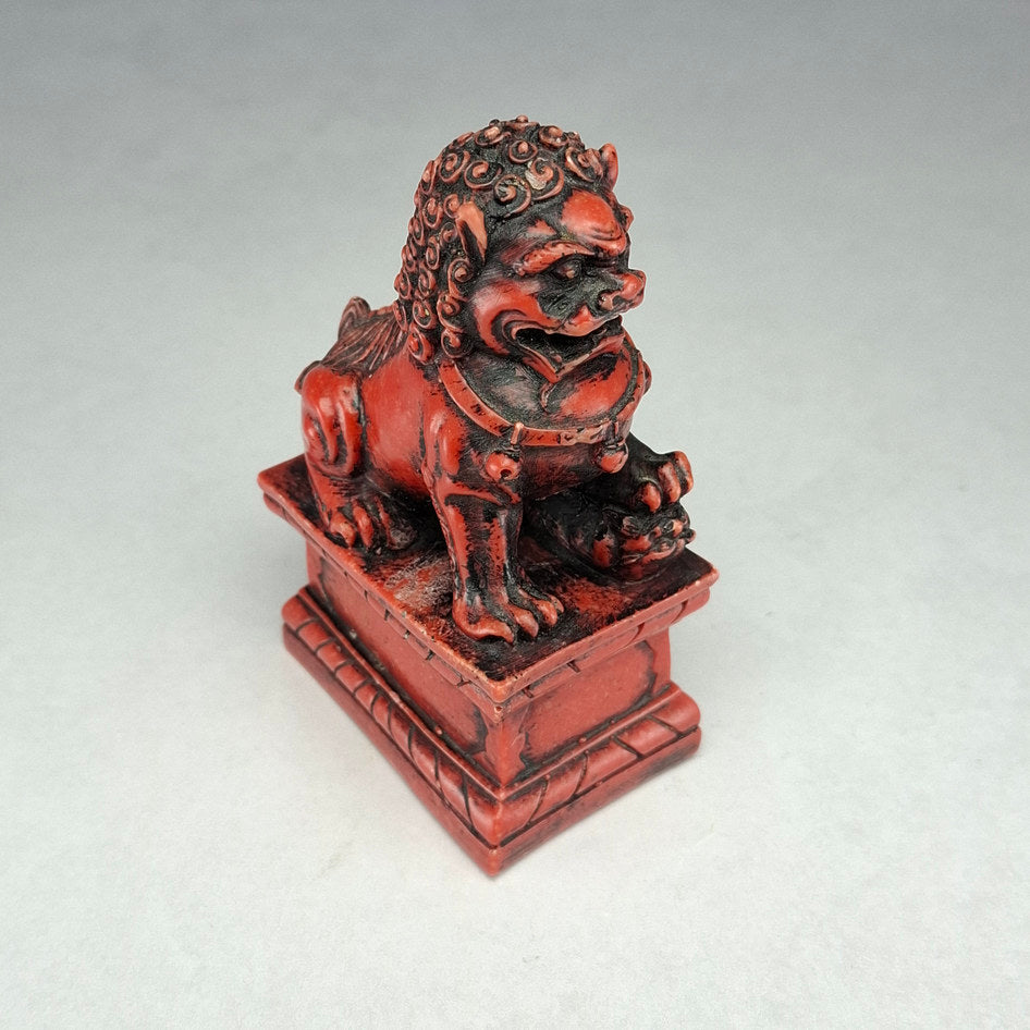 Pair of Red and Black Cast Stone Chinese Guardian Lions