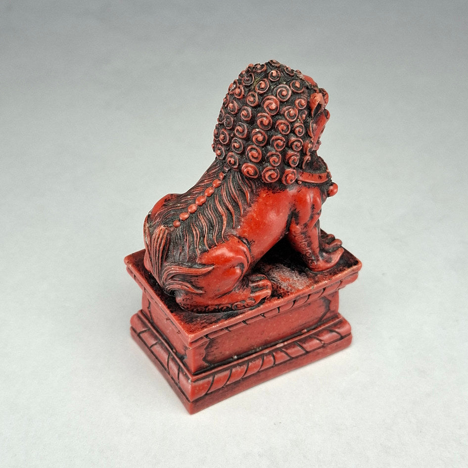 Pair of Red and Black Cast Stone Chinese Guardian Lions