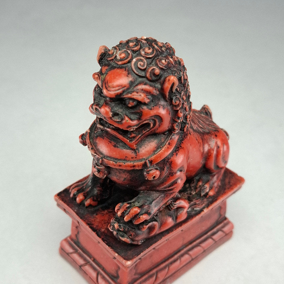 Pair of Red and Black Cast Stone Chinese Guardian Lions