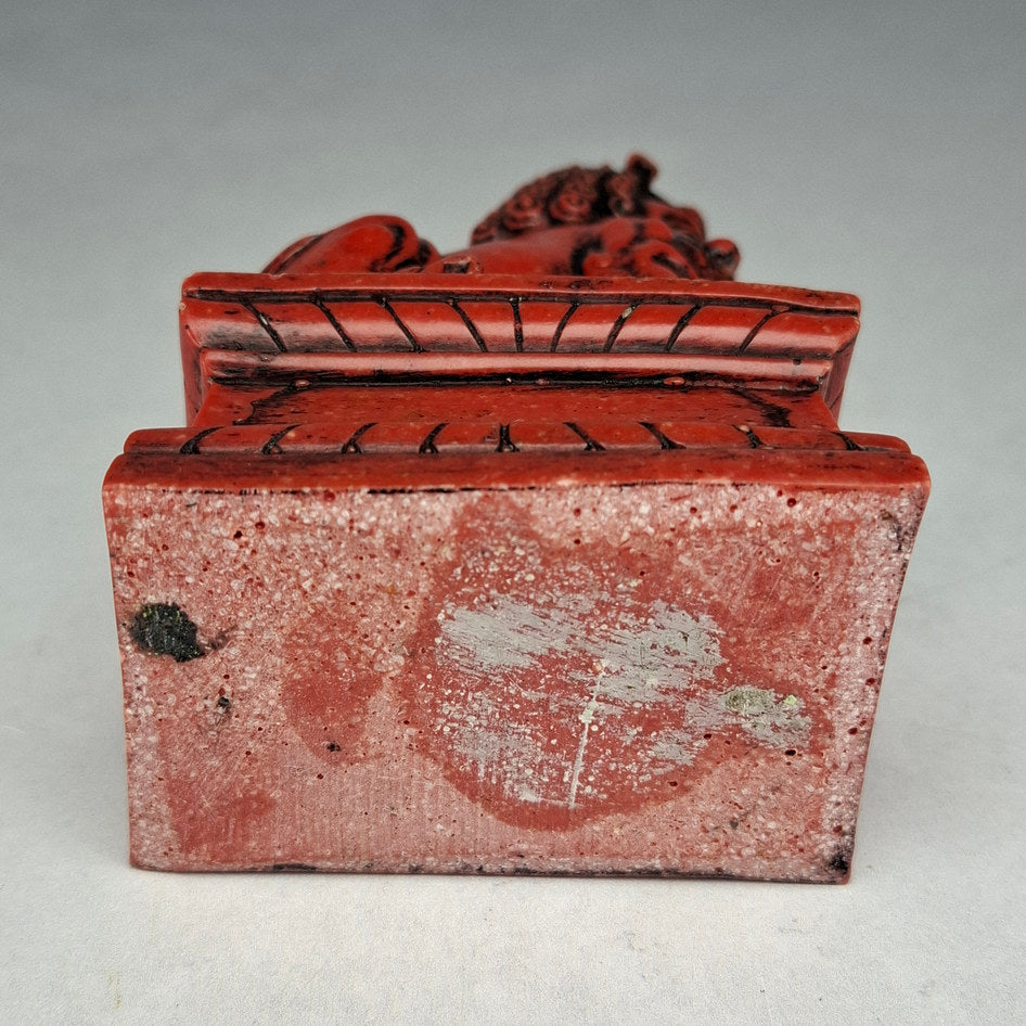 Pair of Red and Black Cast Stone Chinese Guardian Lions