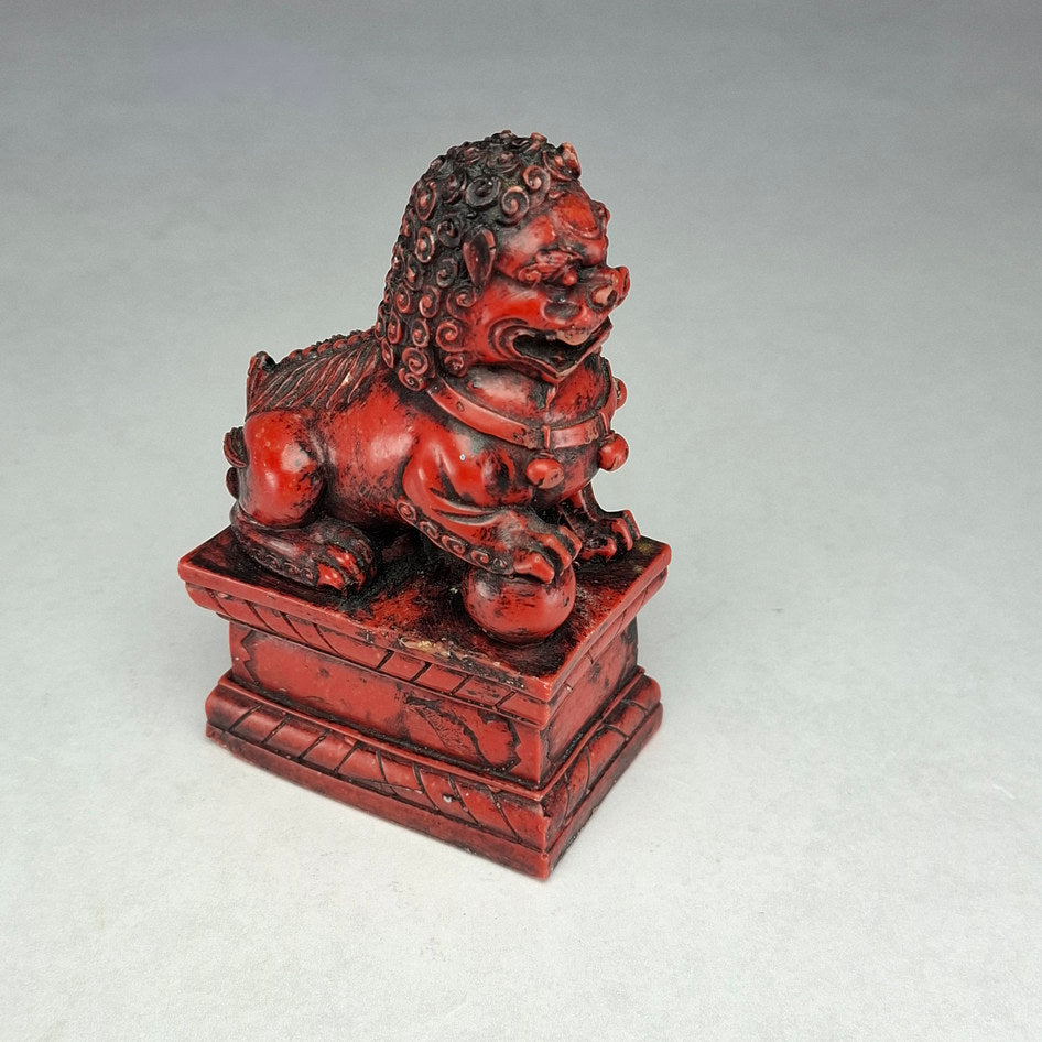 Pair of Red and Black Cast Stone Chinese Guardian Lions
