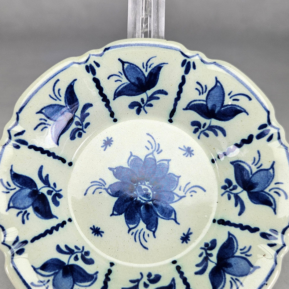 RAM Arnhem dish close-up showing blue flowers on cream glaze
