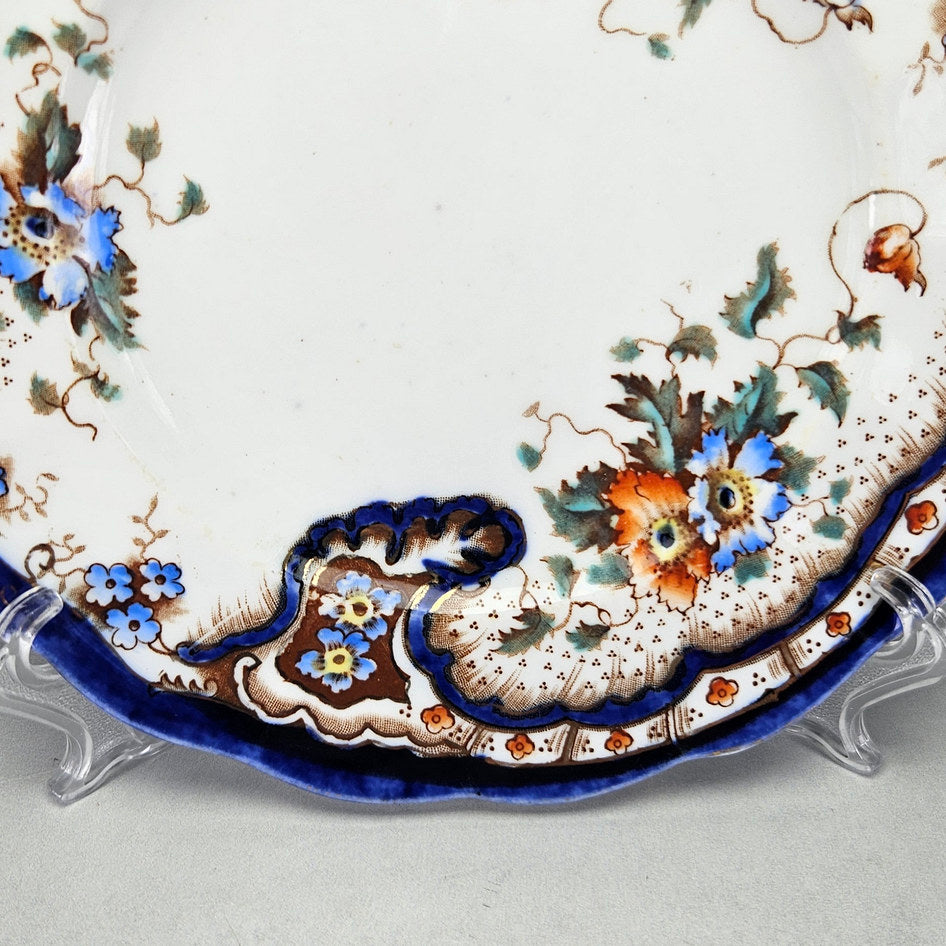 Plant Rococo and Poppy side plate showing its shaped ceramic form