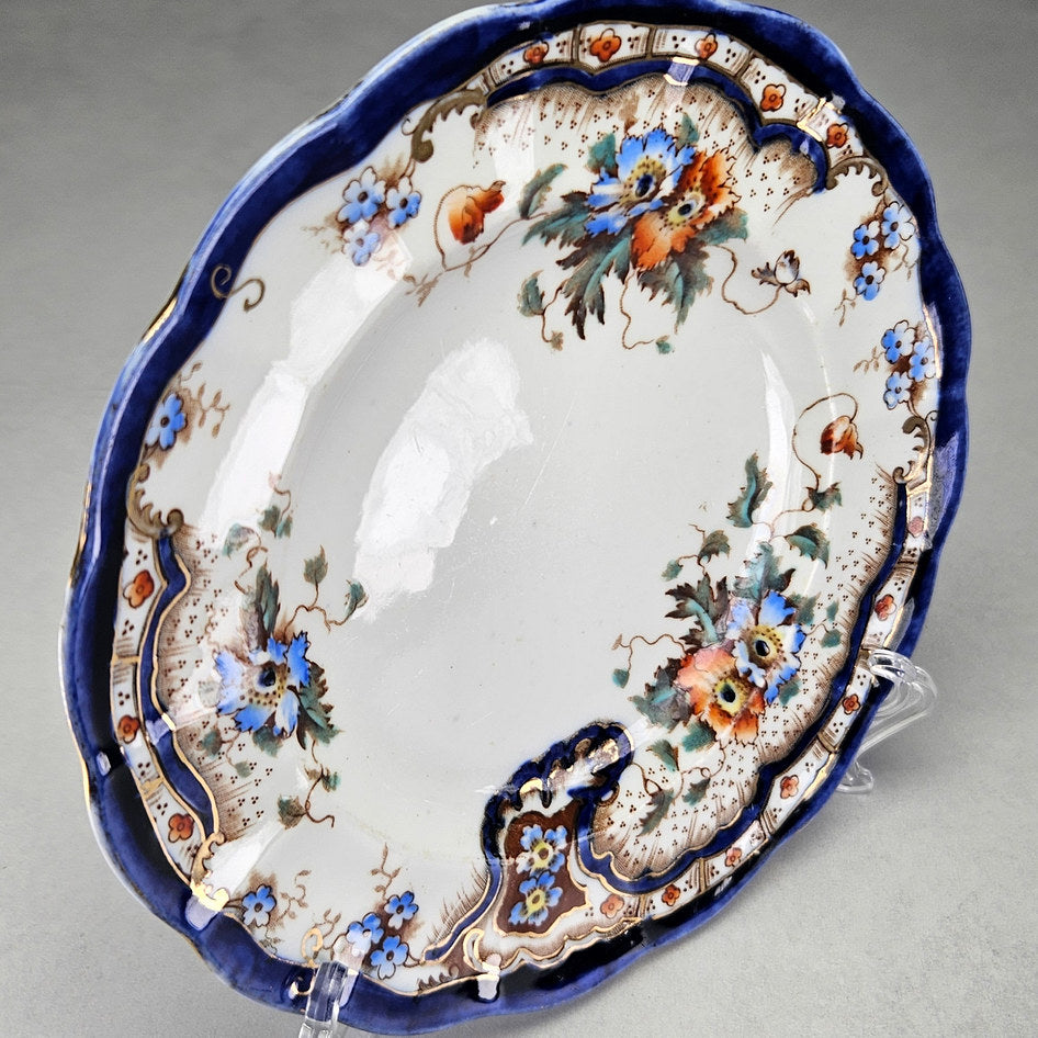 Plant Rococo and Poppy side plate with close floral and border details