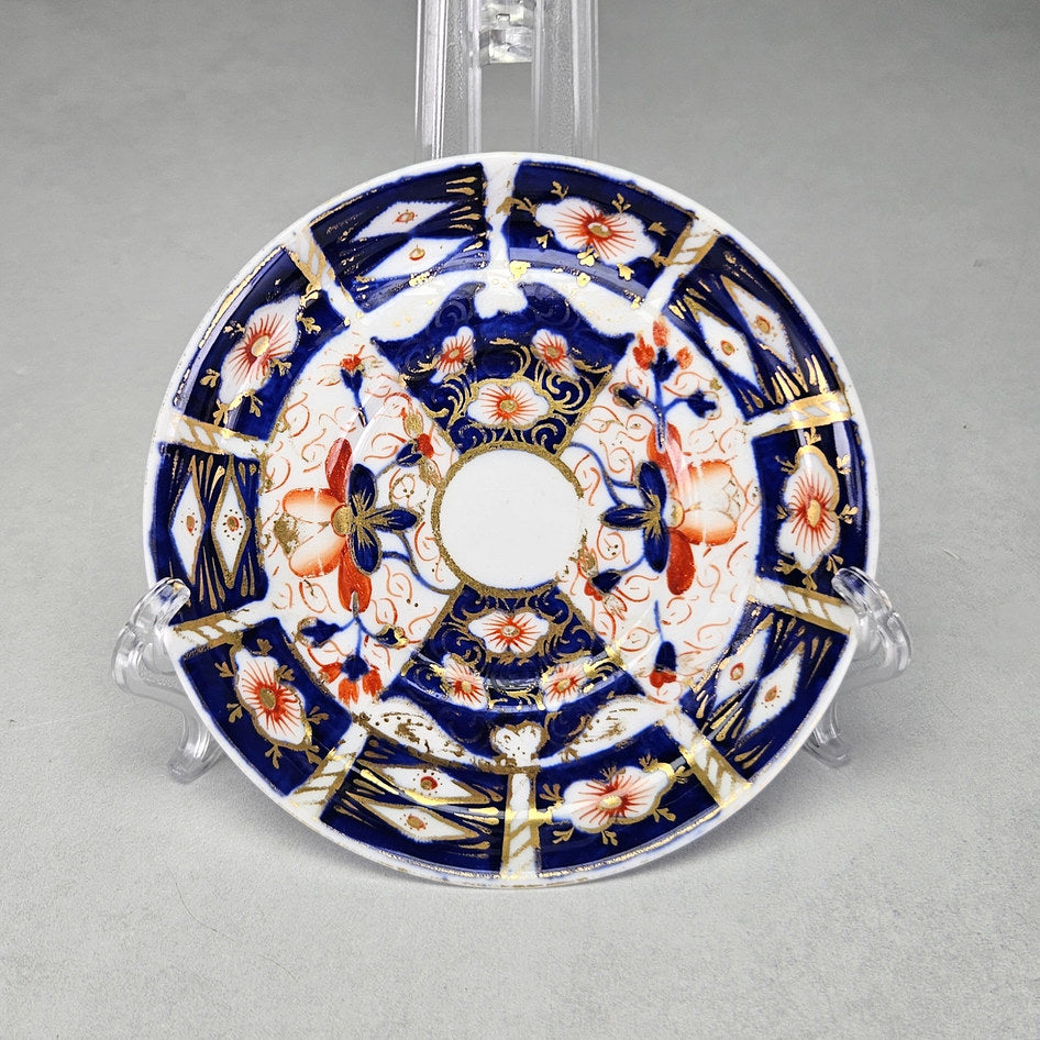 Royal Crown Derby 2451 coffee saucer with iron-red flowers and cobalt panels