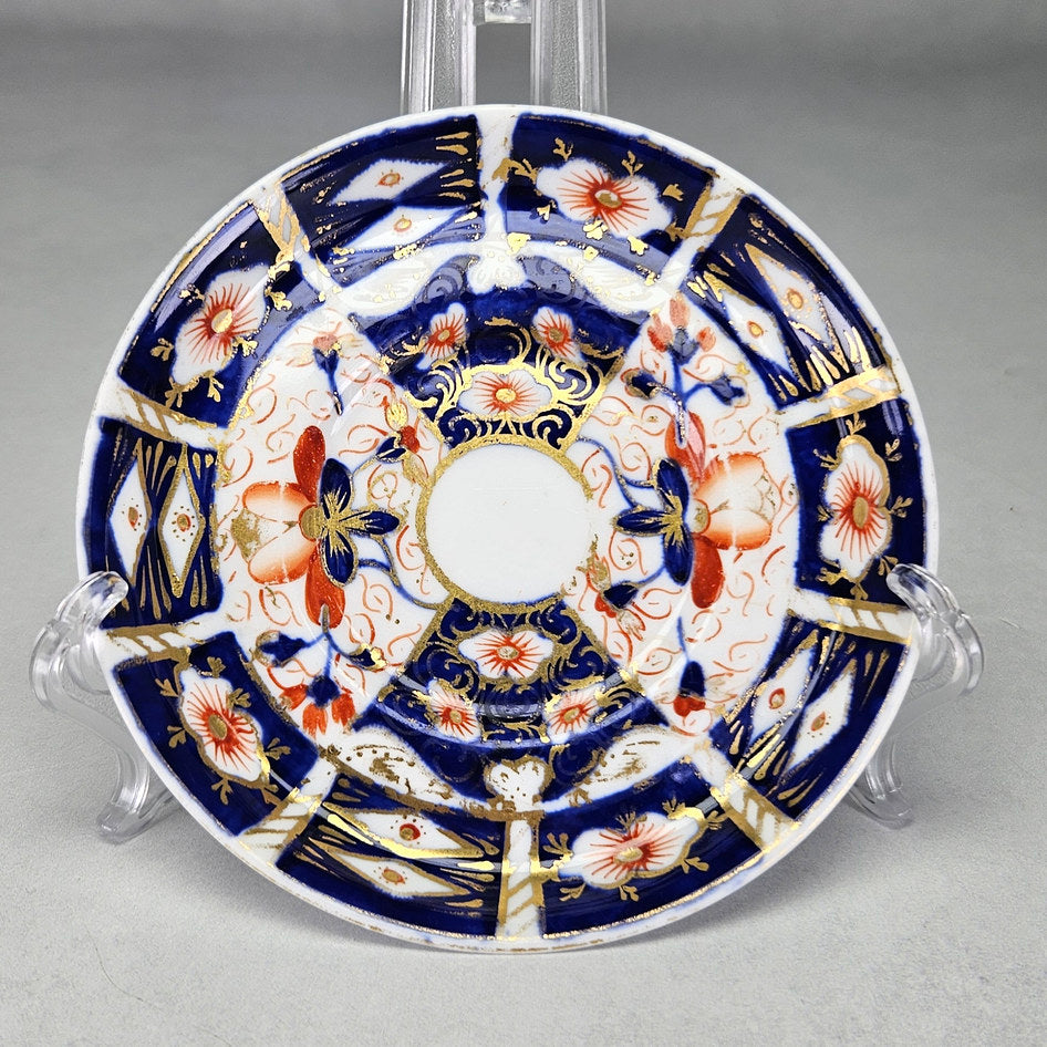 Royal Crown Derby 2451 coffee saucer showing iron-red flowers and cobalt panels