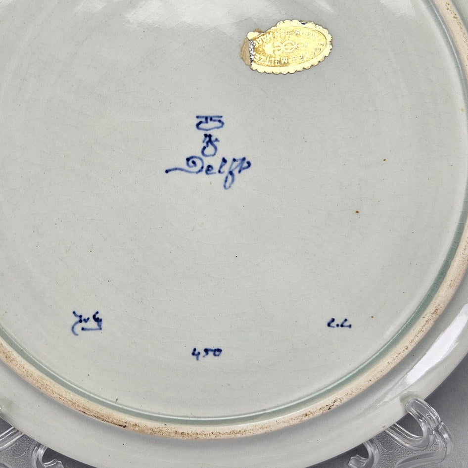 Royal Delft plate reverse close-up showing painted factory and date markings