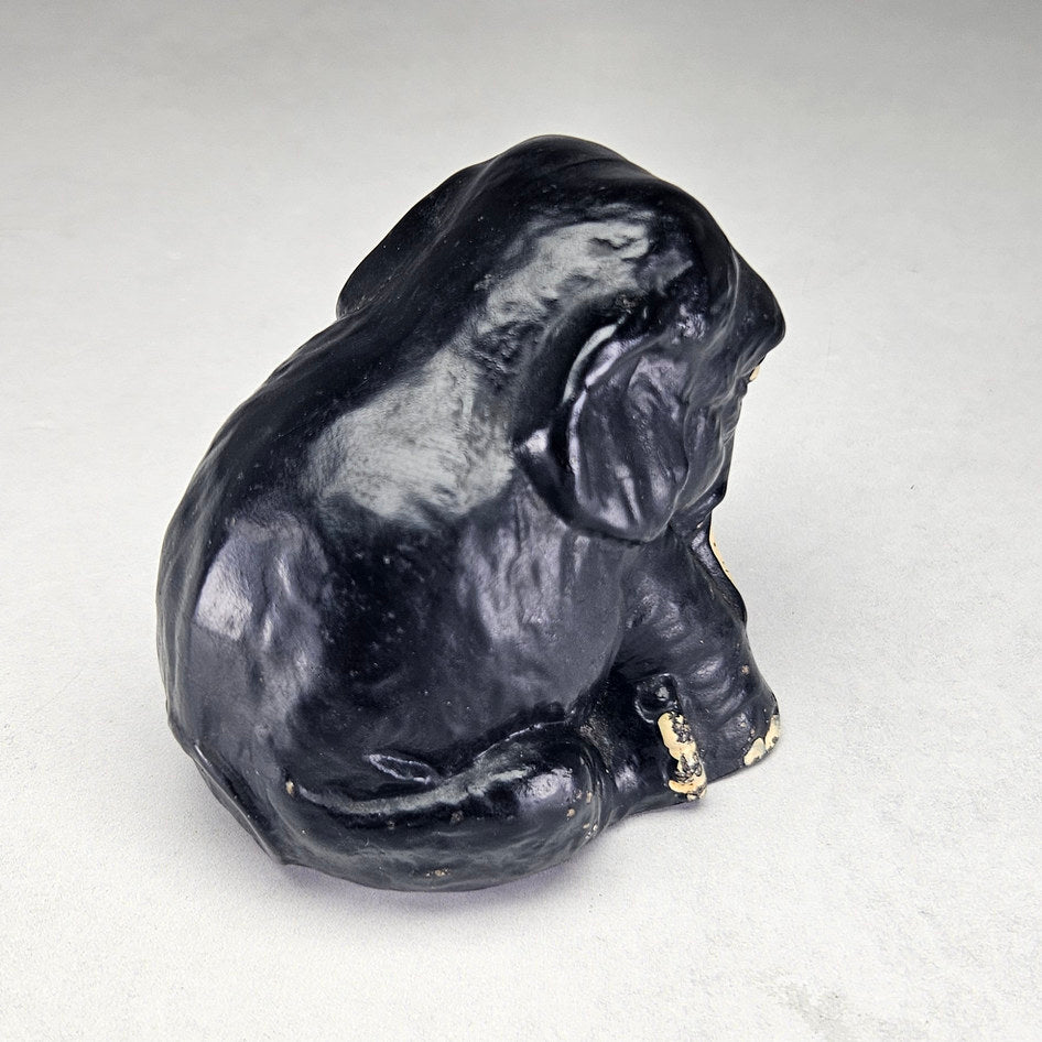 Black seated English ceramic elephant attributed to Sylvac, photograph 3 of this collectible ceramic piece