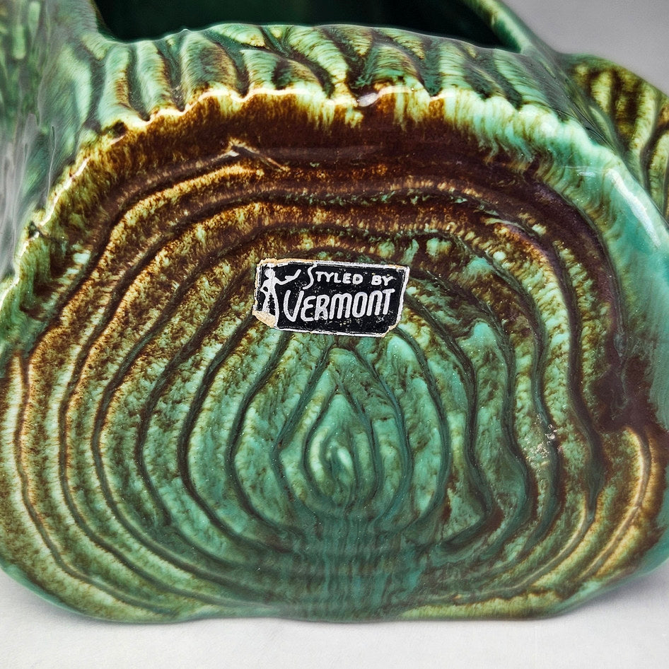 Vermont green log planter showing moulded knots and opening