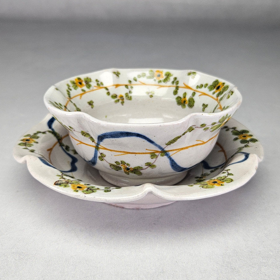 Side view of scalloped Cantagalli cup and saucer