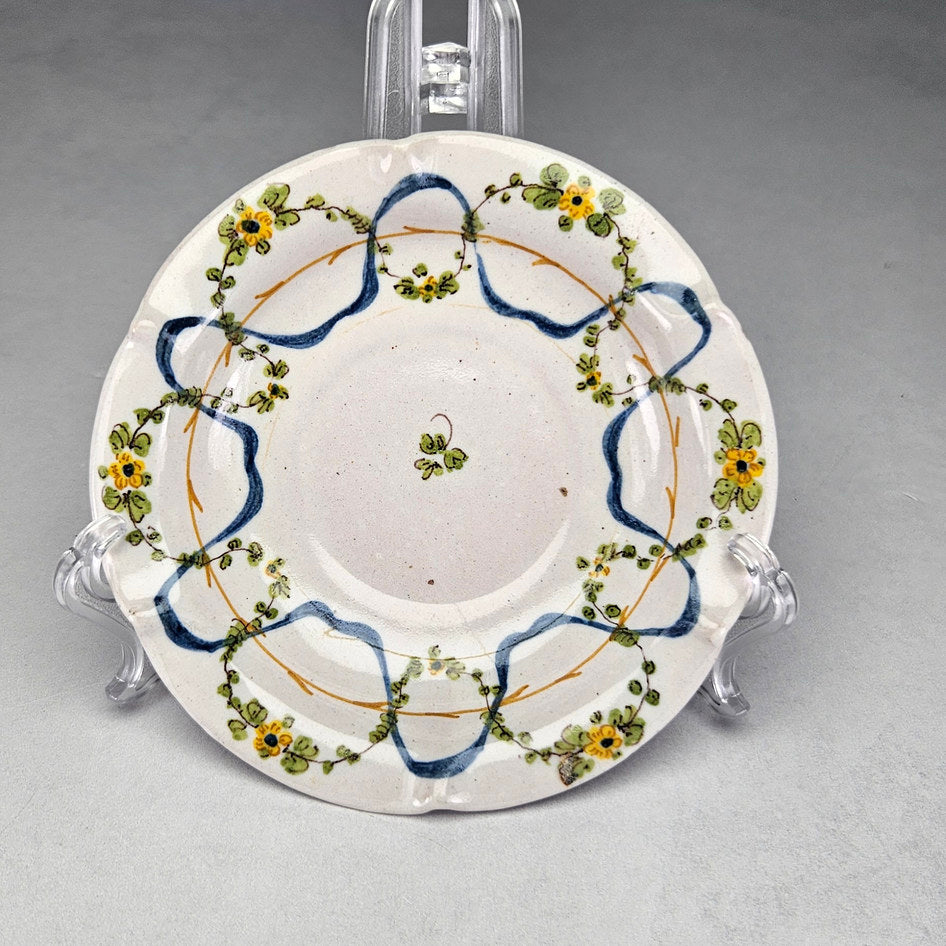Cantagalli maiolica pair showing scalloped edges and flowers