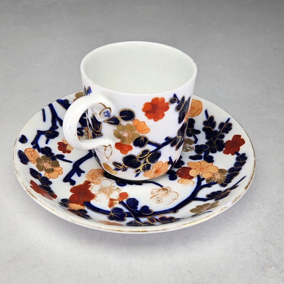 Coalport cup and saucer showing orange blossoms and blue foliage