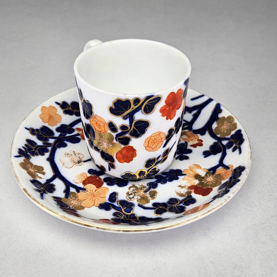 Coalport porcelain cup with floral decoration and gilt accents