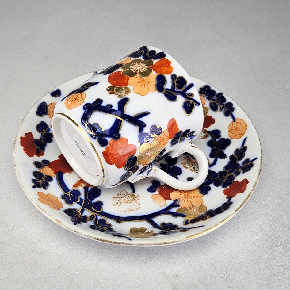 Coalport cup and saucer with painted branches and gold details