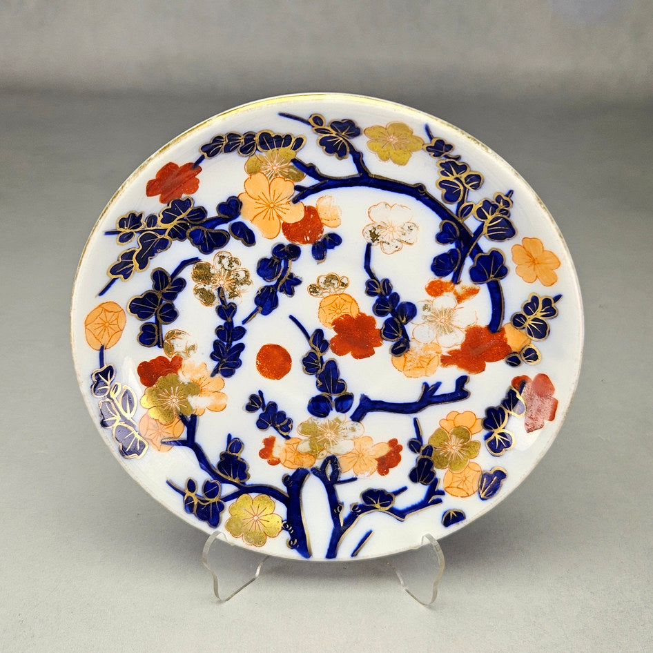 Coalport saucer showing cobalt branches and multicoloured flowers