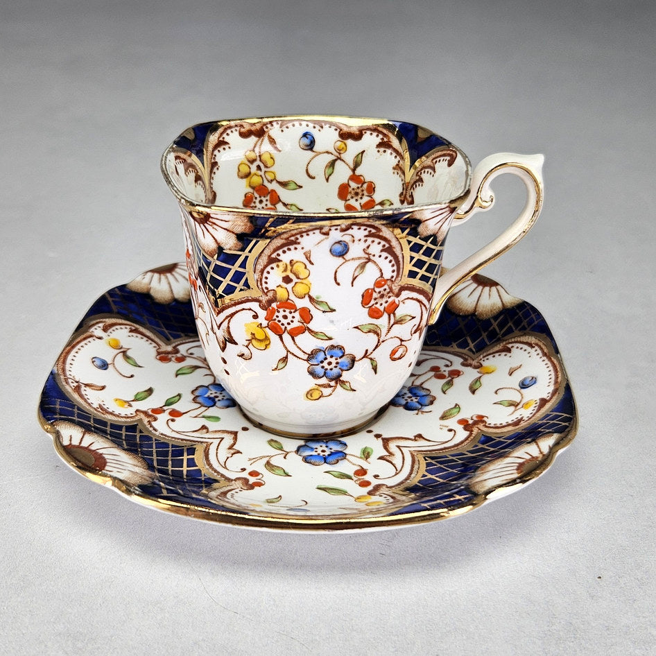English Flosmaron Imari-style cup and scalloped floral saucer