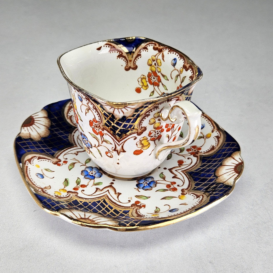 Flosmaron cup and saucer with cobalt and red flowers