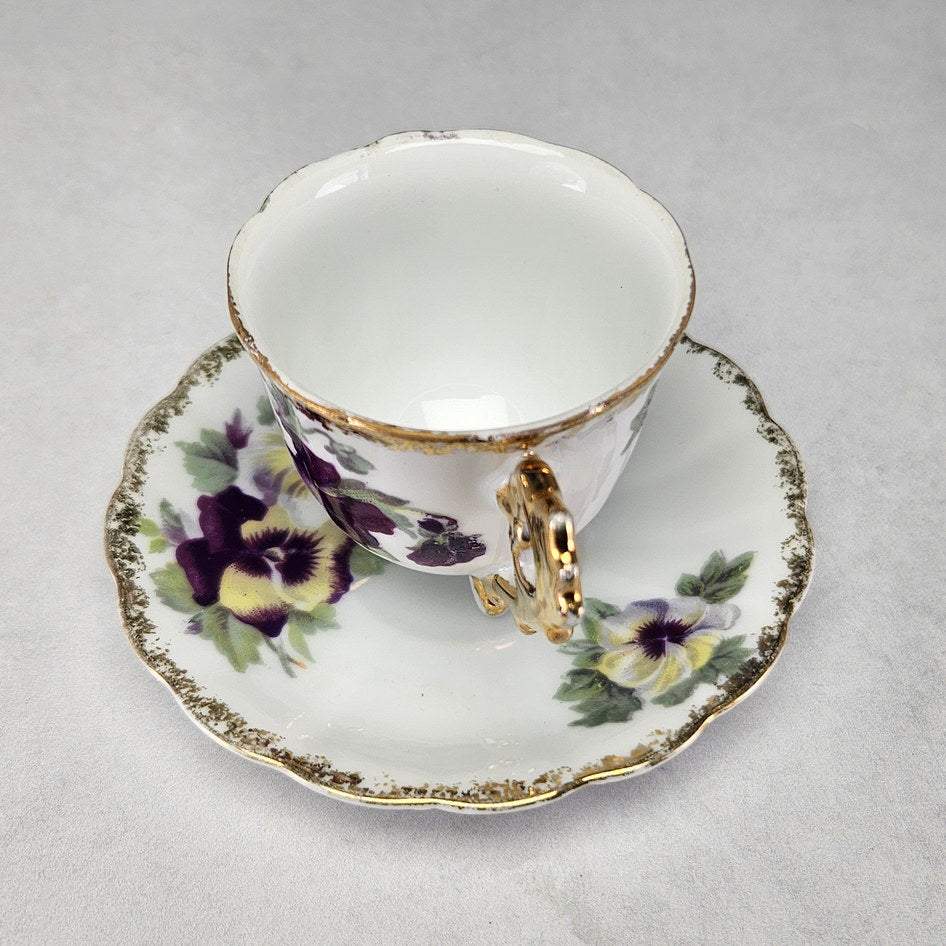 Pansy decorated cup and matching scalloped floral saucer