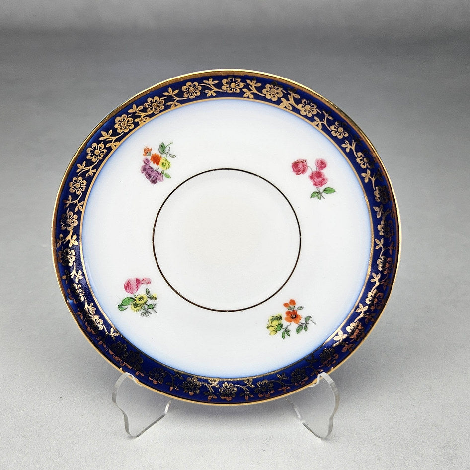 Tivoli saucer with scattered flowers and cobalt border