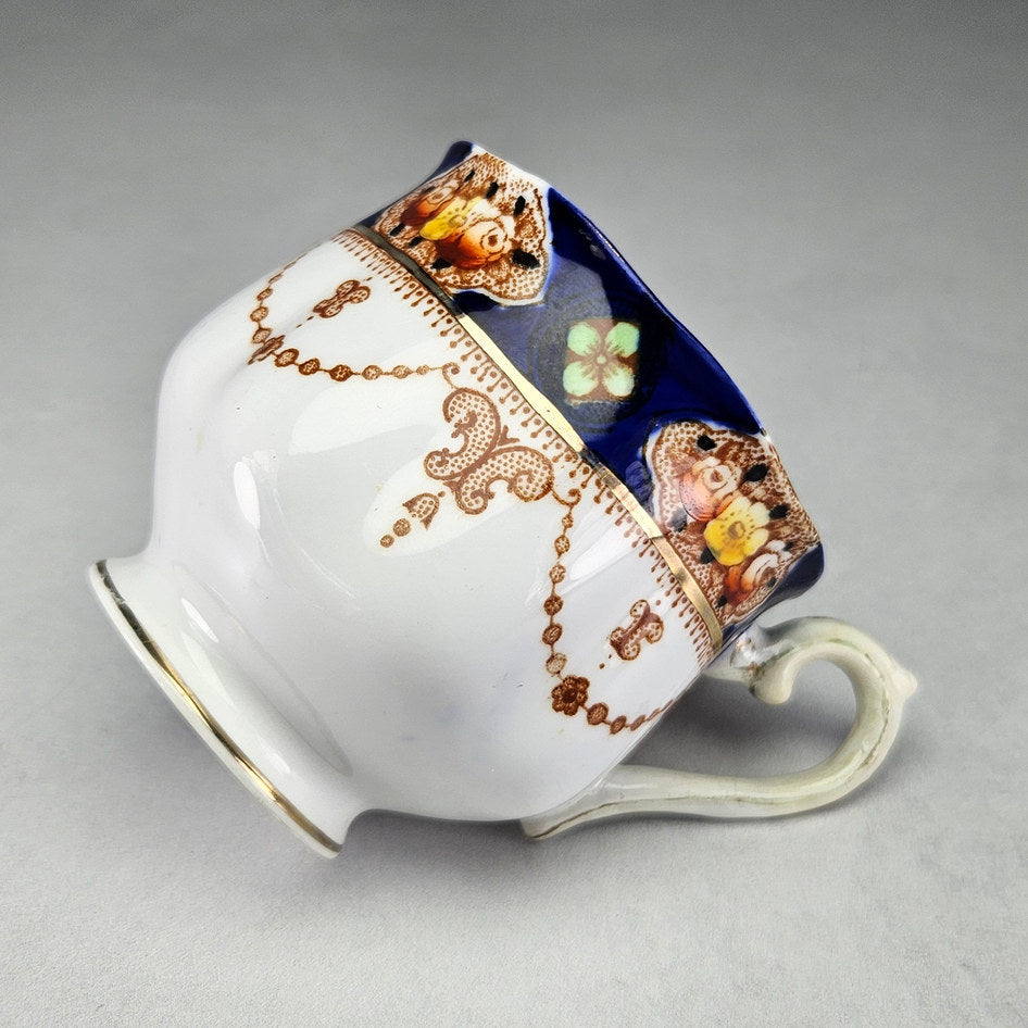 Royal Albert teacup with pedestal foot and brown garlands