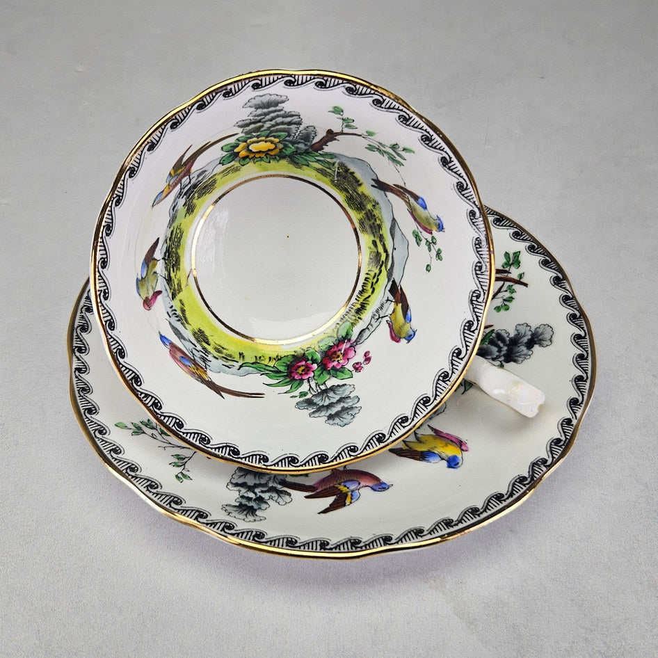Royal Stafford cup with pale pink exterior and gilt handle