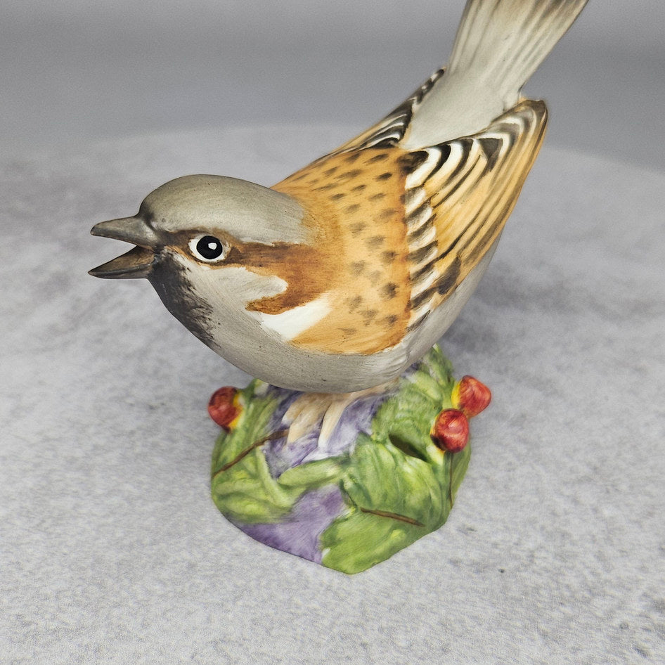 Close up of sparrow figurine's moulded feather detail